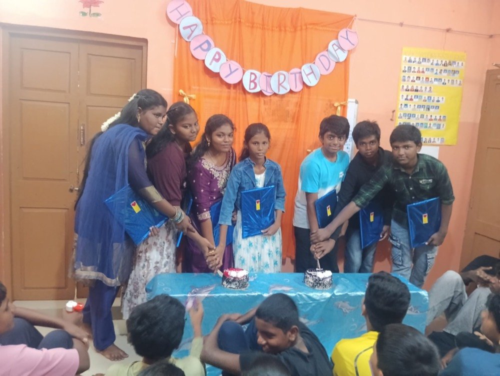 Students celebrating birthdays together with cakes and gifts