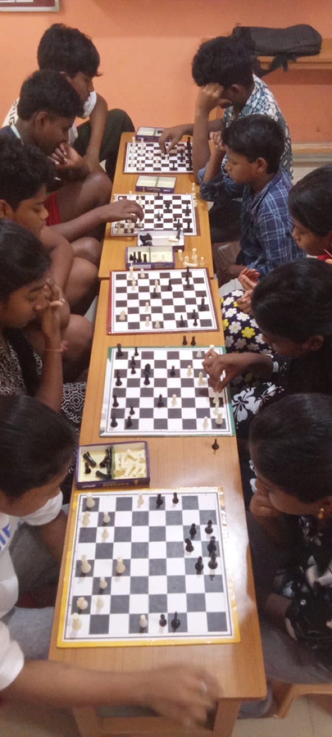 Students playing chess during the tournament