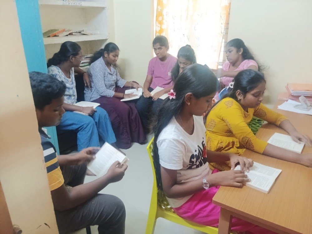 Students reading together in the library